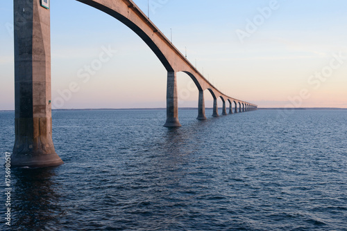 View of the Confederation Bridge extending across the Northumberland Strait between Prince Edward Island and New Brunswick, Canada. Captured at sunset.