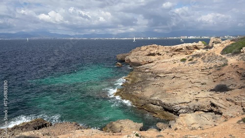 Rocky coastline with turquoise water in palma de mallorca