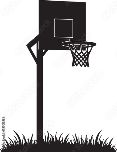 Black silhouette of a basketball hoop and backboard over grass