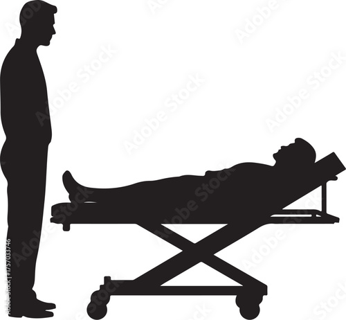 Silhouette of man standing next to patient on stretcher