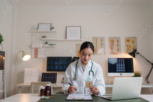 Wallpaper Mural Doctor holding medicine blister packs checking prescription Torontodigital.ca