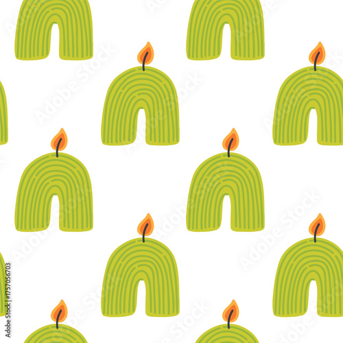 Decorative green rainbow shaped candles with fire flames add charm and cozy atmosphere for celebration or relaxation.