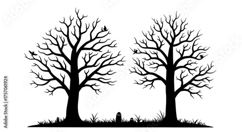 Silhouette of two bare autumn trees with a small gravestone between them creating a spooky or melancholy atmosphere for design isolated on white background