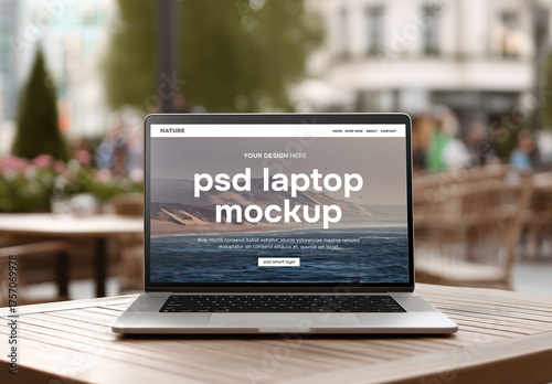 Front view laptop mockup on a table in an outdoor restaurant or pavement cafe