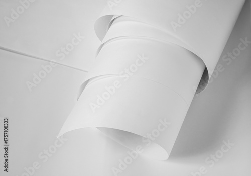 A roll of white paper in black and white.