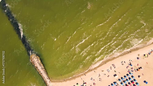 Aerial view of the summer Adriatic coastline with colorful umbrellas near Ravena