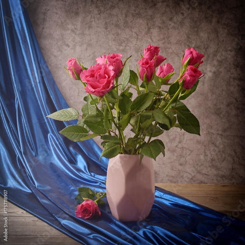 Bouquet of pink roses, still life, blue background, holiday card.