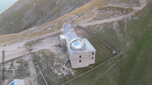 Aerial drone footage of the Astronomical Observatory of Abruzzo at Campo Imperatore, set against majestic mountain landscapes