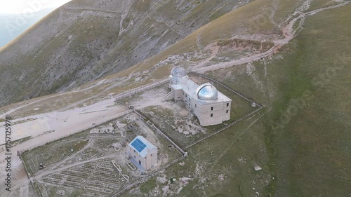 Aerial drone footage of the Astronomical Observatory of Abruzzo at Campo Imperatore, set against majestic mountain landscapes