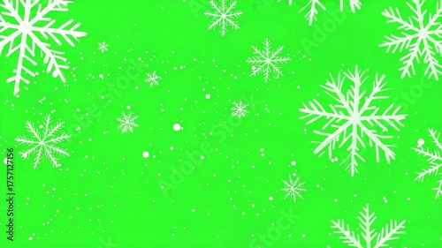 White snowflakes of different sizes gently falling and swirling across the snowflakes move on green background