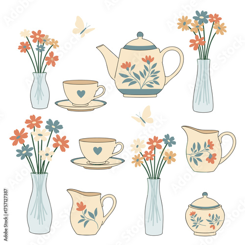 A charming collection of vintage teacups floral arrangements and creamers with delicate butterflies fluttering about.