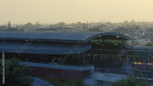 Delhi metro station view with passengers waiting on platform