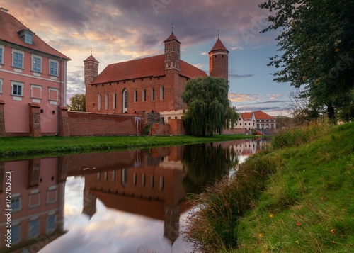 view of the Palace of the Warmian Bishops at sunset