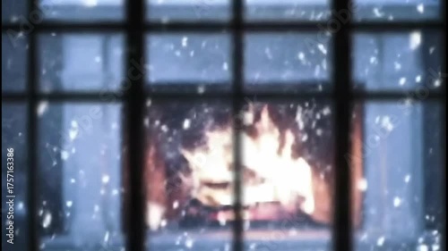 Cozy fireplace glowing with snow falling outside the window  