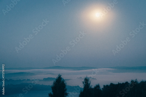 Full moon over the valley of fog