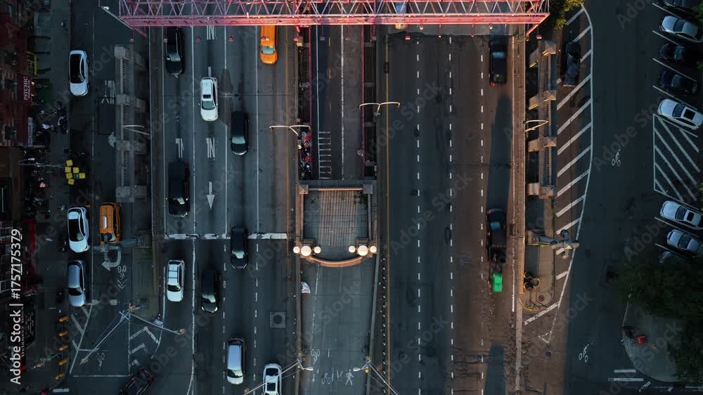Aerial view of the bustling Williamsburg Bridge in New York City, capturing the essence of urban life with its iconic architecture and dynamic traffic flow