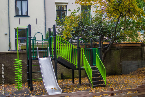 A bright, empty playground with a variety of colorful children's equipment that encourages active play and healthy development. High quality photo