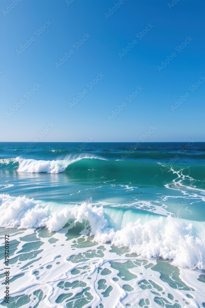 Obraz premium Vast ocean waves meet a clear, bright blue sky in a serene coastal landscape, tranquil, cloudless