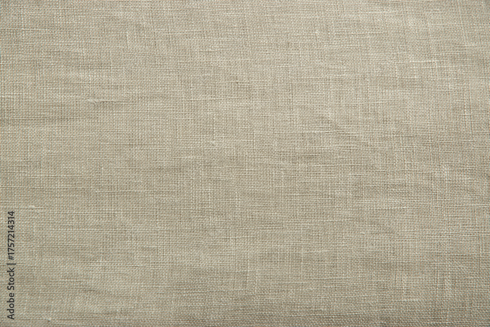 Fototapeta premium Close up view of oatmeal linen woven fabric. Quality natural textile texture ideal for backgrounds or design