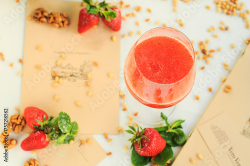 strawberry cocktail in a glass on a background with food decor