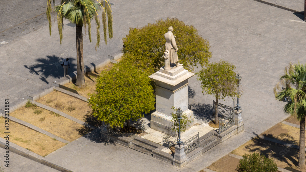 Fototapeta premium Aerial view of the monument to Carlo Cottone located in the historic center of Palermo, Sicily, Italy. It is a marble statue in the center of the square.
