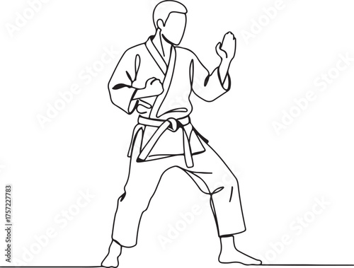 Man in martial arts uniform in a defensive stance karate