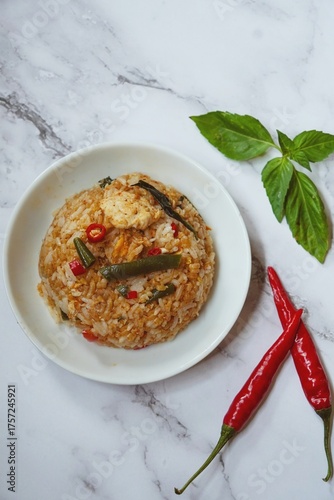 Thai basil fried rice with chicken and veggies served in a bowl, selective focus