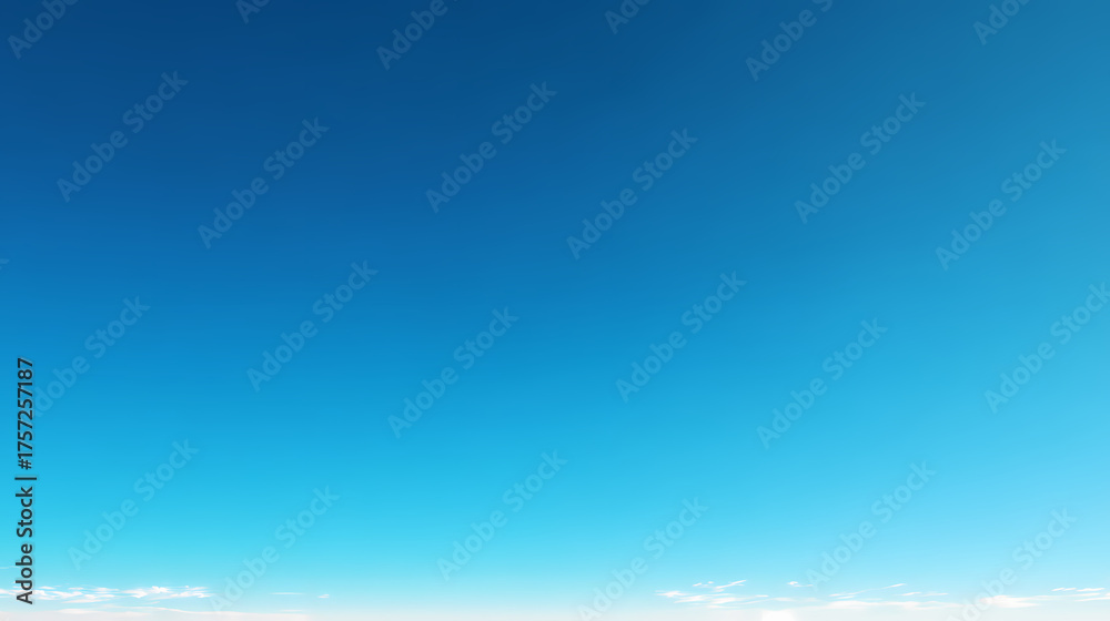 Fototapeta premium Vibrant Blue Sky with Wisps of Clouds - A Breathtaking Display of Nature's Beauty