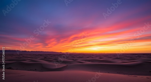 The gradient of colors in a desert sky at twilight.