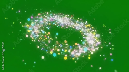 Magical rainbow glitter trail swirling with vibrant confetti sparkles on green screen for festive overlays