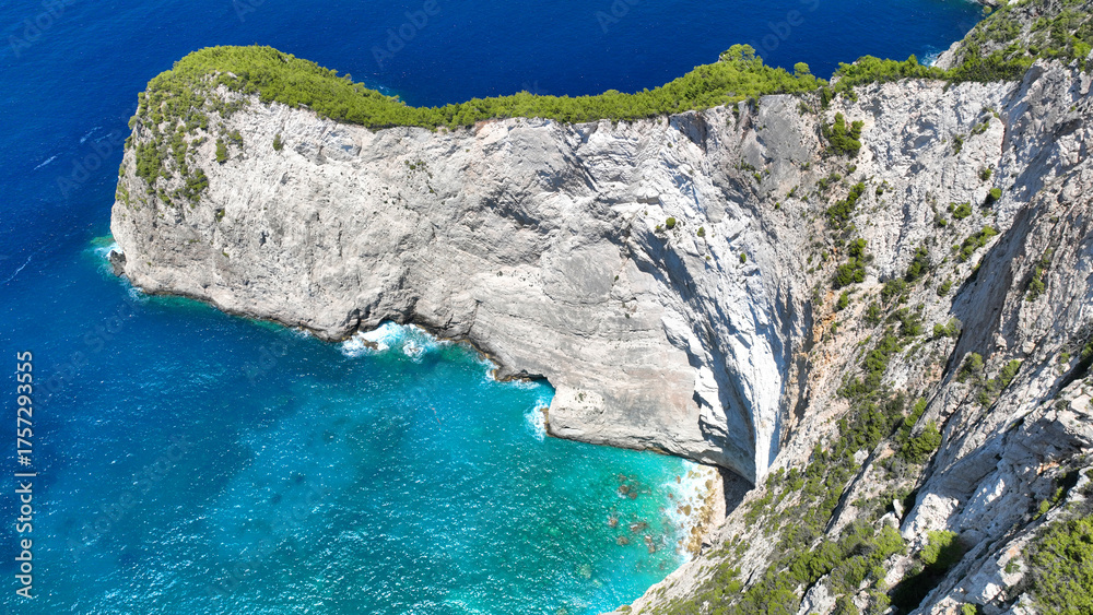 Obraz premium Aerial drone photo of tropical Caribbean island fjord shaped paradise bay with white rock arch caves and turquoise clear sea