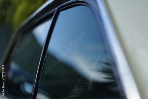 Close-Up View of a Car Window and Reflection Highlighting Modern Automotive Design and Glass Finish