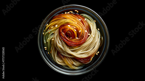 Glossy glass noodles arranged in a spiral with sesame seeds. Amber gradients and clear bowl evoke clarity, texture, and editorial depth in culinary and lifestyle storytelling.
