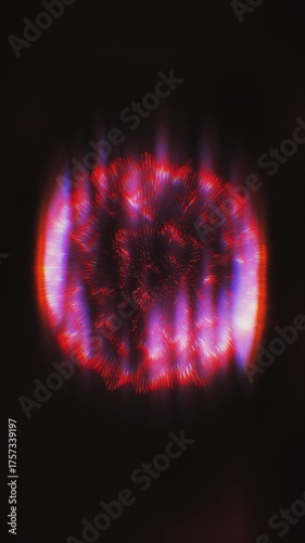 Red and purple lights dance on dark, creating vibrant sphere patterns.