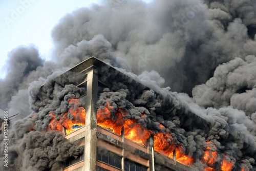 Fire service personnel are extinguishing the fire stock photo