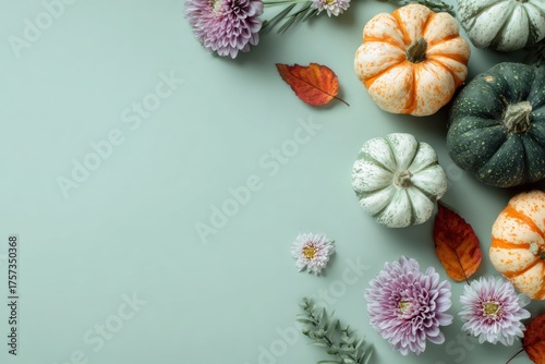 Halloween background with orange green pumpkin, autumn flowers. Olive green backdrop. Modern Holiday design. party border natural colour. Thanksgiving trendy fall decoration. Nordic, hygge, cozy home.