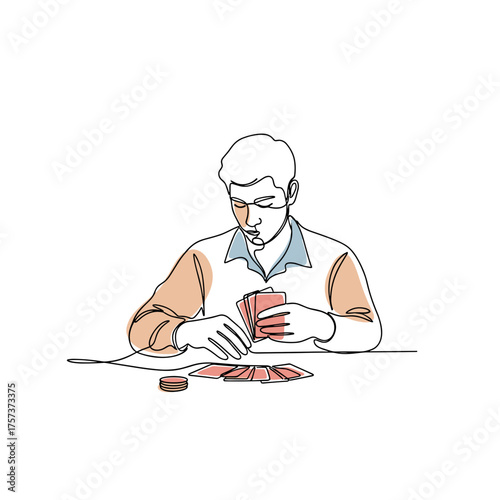 Man concentrating while playing solitaire with cards at a table  