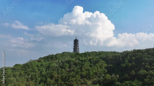 The shadow of Xiangshan Pagoda pierces the clouds, while beneath the cloud masses lies the scenic beauty of Xiangshan