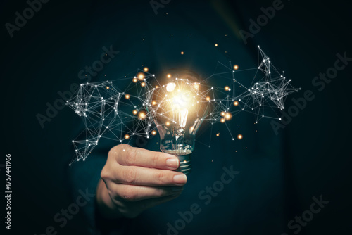 Glowing light bulb in hand, idea search concept Creativity from information trade in the internet world, marketing, business ideas and target groups.