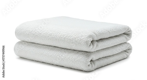 Two folded white towels are stacked
