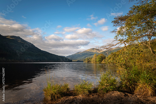 A sunny, autumnal HDR image of Loch Eck looking north from the shore of Jubilee point picnic site, Argyll and Bute, Scotland.