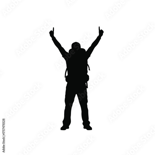 Hiker with arms raised in victory silhouette