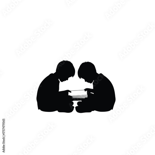 Two children reading together silhouette