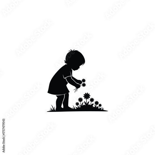 Young child picking flowers silhouette