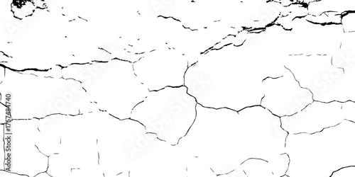 Black and white surface showing cracked, aging wall with peeling textures—great for urban decay themes or digital artwork.
