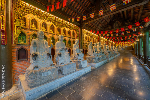 Buddha statues along the corridor lead to Bai Dinh pagoda, one of the largest in the south east Asia in Ninh Binh, Vietnam
