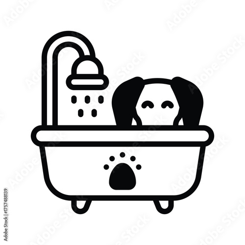 A dog is in a bathtub under a showerhead The tub has a paw print