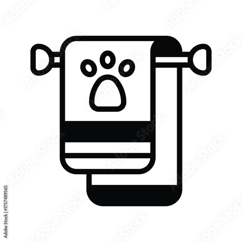 A towel with a paw print hangs on a towel rack