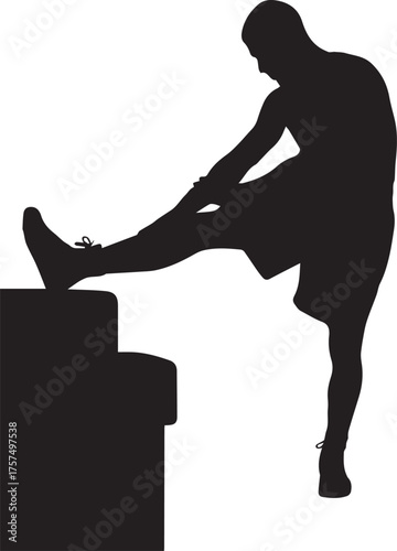 Silhouette of athlete stretching leg on box before workout or training session