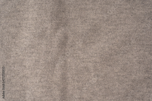 Soft grey merino wool sweater texture as a background.